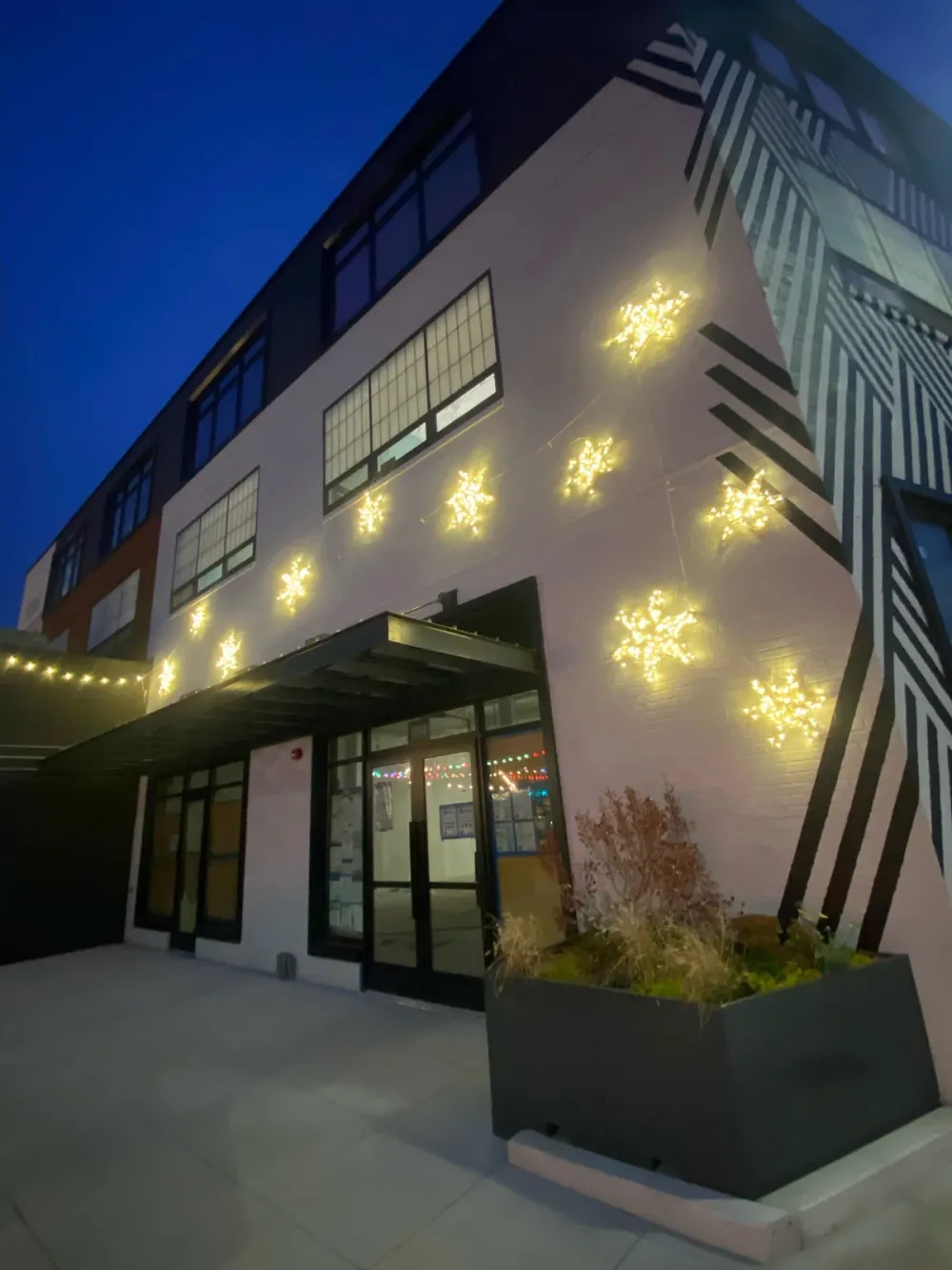 Illuminated commercial holiday display lighting a public space
