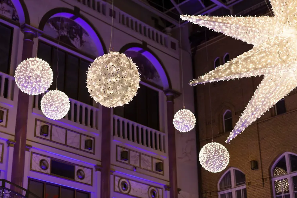 Illuminated commercial holiday display lighting a public space