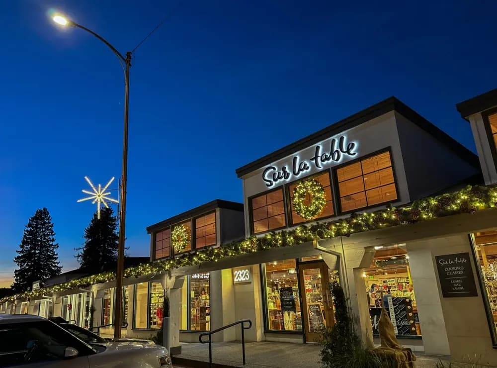 Illuminated LED snowflake pole motif mounted on a street light